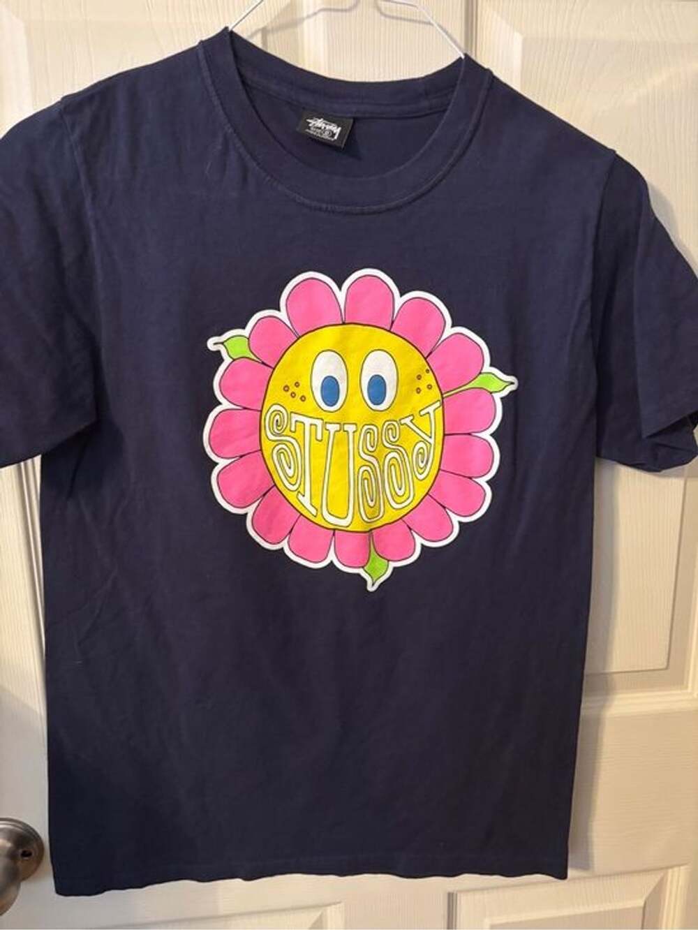 Stussy Navy women’s Tee with Pink & Yellow Flower Face Graphic